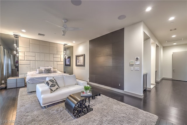 bedroom with ceiling fan and dark wood-type flooring