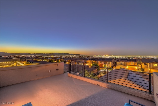 view of balcony at dusk