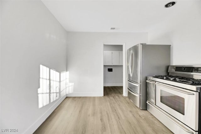 kitchen featuring light hardwood / wood-style flooring and stainless steel range with gas stovetop