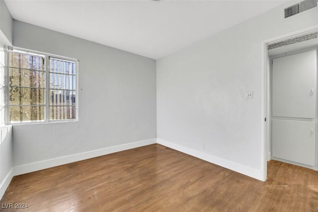 empty room featuring hardwood / wood-style flooring