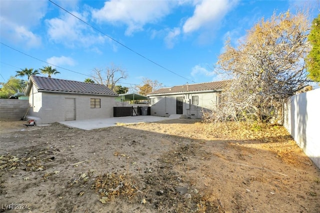 back of property with a patio area