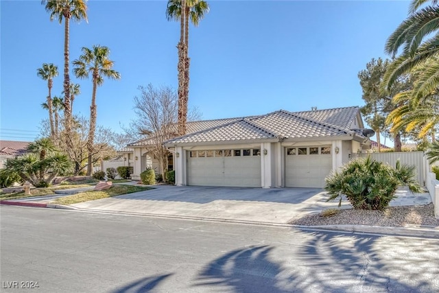 mediterranean / spanish house featuring a garage