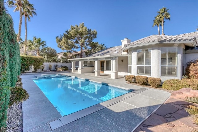 view of swimming pool with a patio