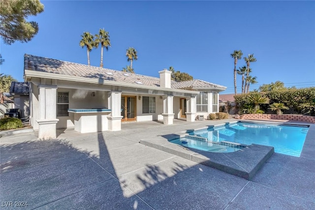 exterior space featuring a fenced in pool and a patio area