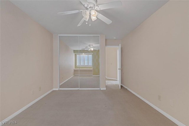 spare room with light carpet and ceiling fan