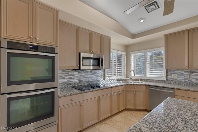 kitchen with light brown cabinetry, decorative backsplash, sink, and stainless steel appliances