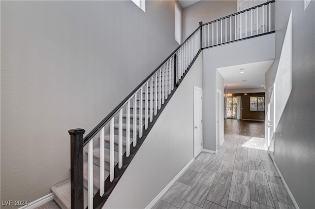 stairway with a towering ceiling