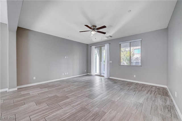 unfurnished room featuring ceiling fan