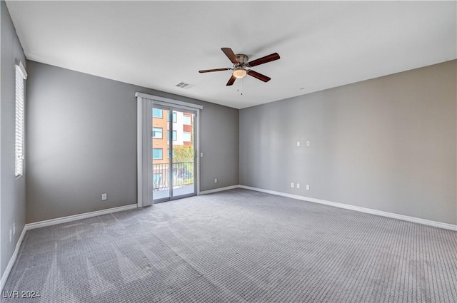 unfurnished room featuring carpet and ceiling fan