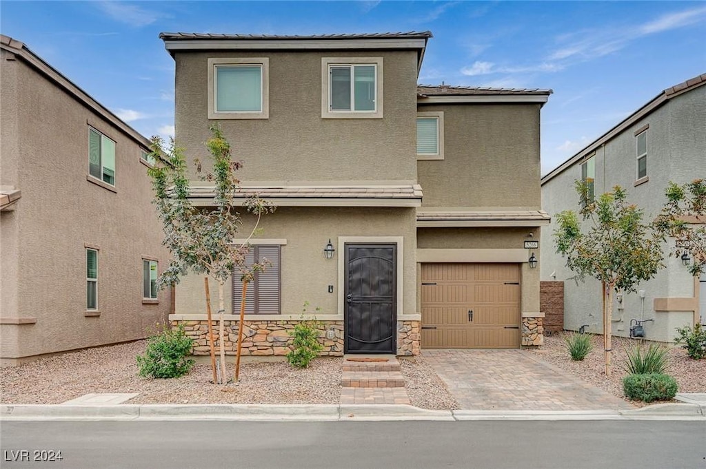 front facade with a garage