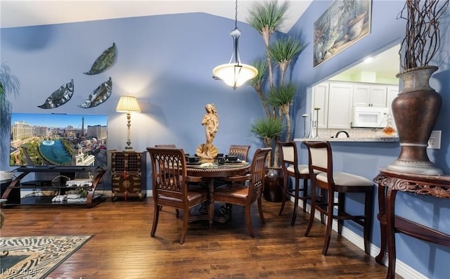 dining space featuring dark hardwood / wood-style floors