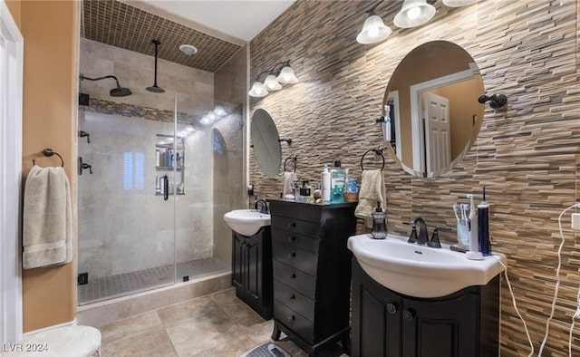 bathroom featuring vanity, backsplash, tile walls, and a shower with shower door