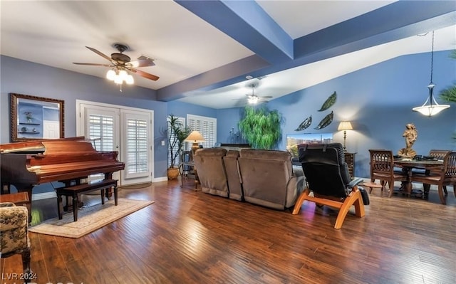 living room with ceiling fan and dark hardwood / wood-style flooring