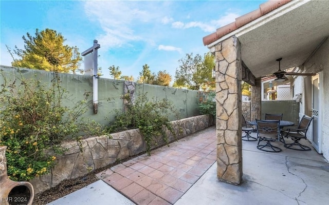 view of patio featuring ceiling fan