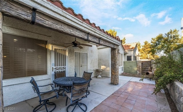 view of patio featuring ceiling fan