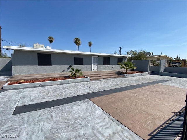 ranch-style home with a patio area