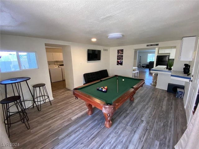 game room featuring a textured ceiling, dark hardwood / wood-style floors, and pool table