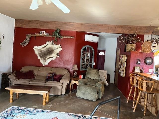 living room featuring a wall mounted air conditioner and ceiling fan