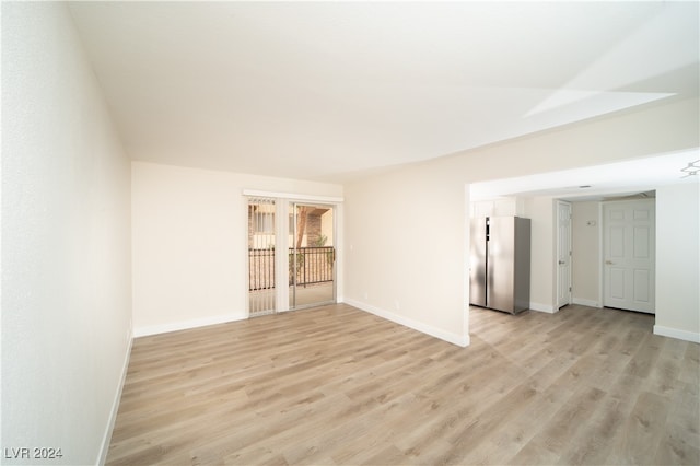 spare room featuring light hardwood / wood-style flooring