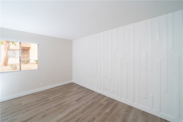 spare room featuring light hardwood / wood-style floors