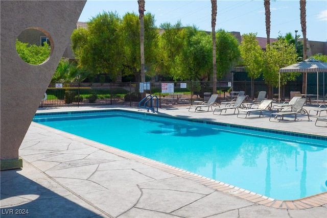 5260 River Glen Dr Unit 261, Las Vegas, NV 89103 - community pool featuring a patio