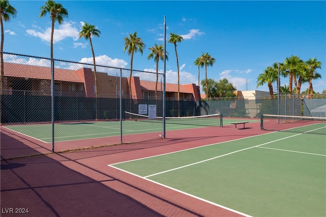 view of tennis court featuring basketball court