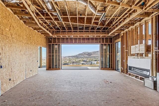 miscellaneous room with a mountain view