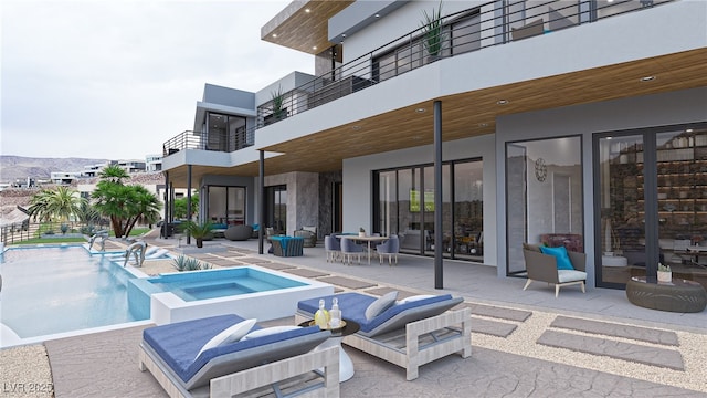 exterior space featuring a patio area and a hot tub