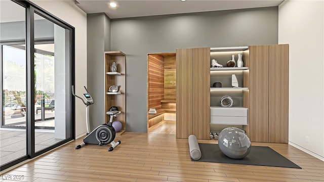 exercise area with wood finished floors