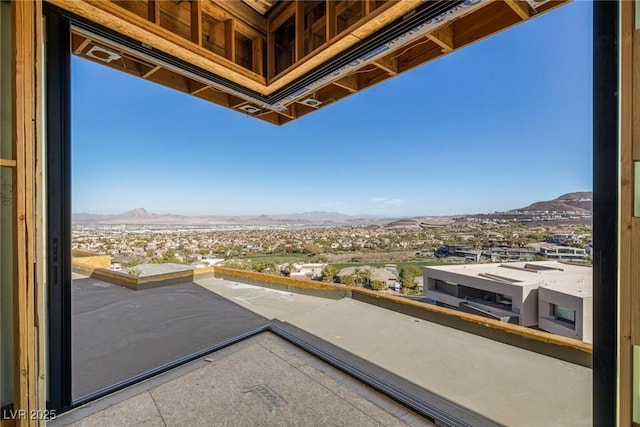 balcony featuring a mountain view