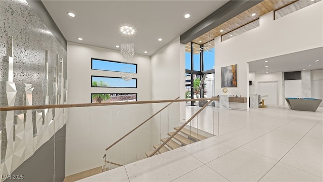 1487 Reims Dr, Henderson, NV 89012 - hall featuring a healthy amount of sunlight, a high ceiling, recessed lighting, tile patterned floors, and a chandelier