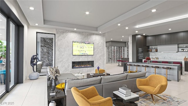 1487 Reims Dr, Henderson, NV 89012 - living room featuring recessed lighting, a high end fireplace, a raised ceiling, and light tile patterned flooring
