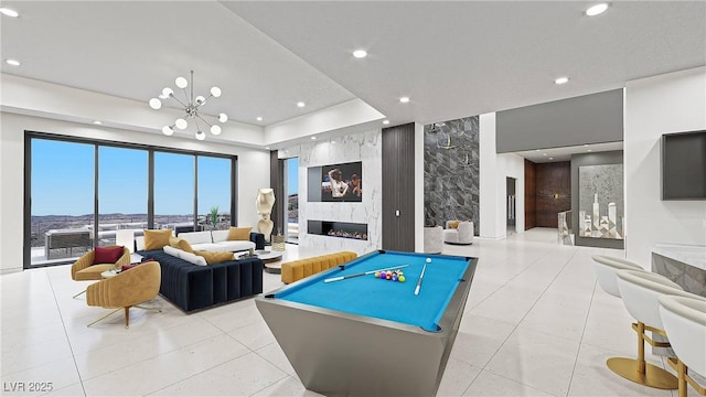 1487 Reims Dr, Henderson, NV 89012 - game room featuring a premium fireplace, recessed lighting, tile patterned floors, and a chandelier
