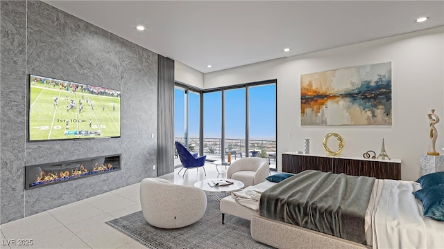 1487 Reims Dr, Henderson, NV 89012 - tiled bedroom with recessed lighting and a glass covered fireplace