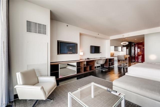 living room with dark hardwood / wood-style floors