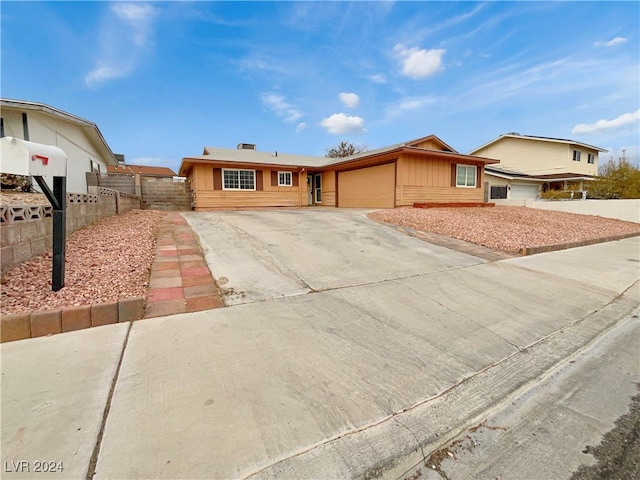 single story home with a garage