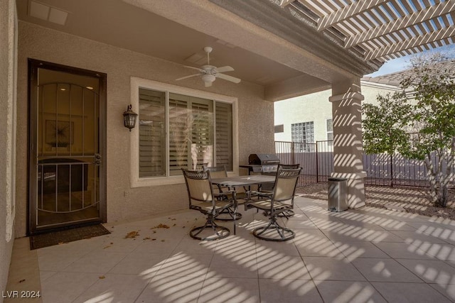 view of patio with ceiling fan and a pergola