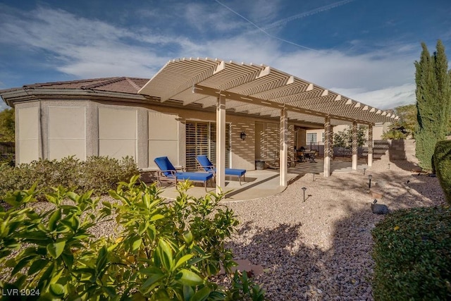 exterior space with a pergola and a patio