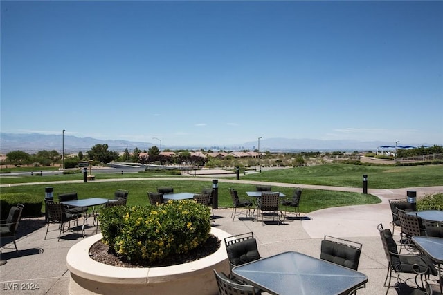 view of patio / terrace featuring a mountain view