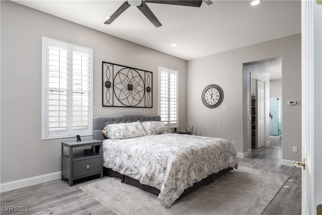 bedroom featuring light hardwood / wood-style floors and ceiling fan