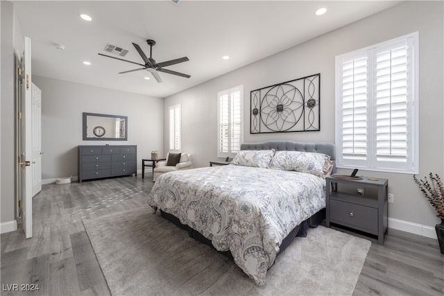 bedroom featuring ceiling fan and hardwood / wood-style floors