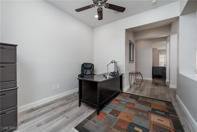 office space featuring wood-type flooring and ceiling fan