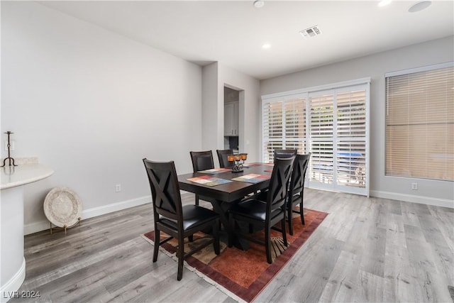 dining room with light hardwood / wood-style floors