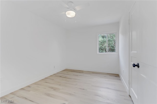 spare room featuring light hardwood / wood-style floors