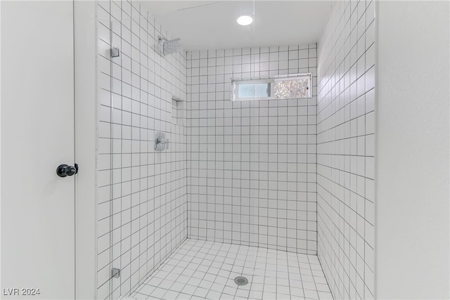 bathroom with a tile shower