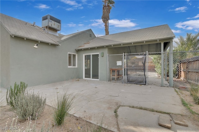 back of house featuring a patio and central air condition unit