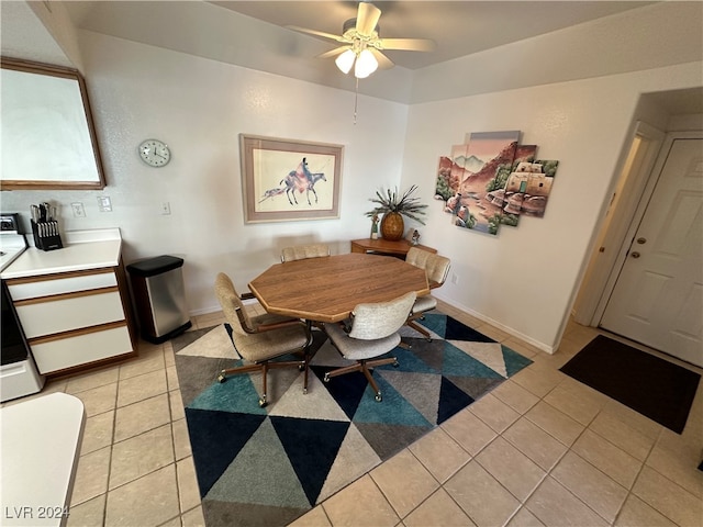 tiled dining area featuring ceiling fan