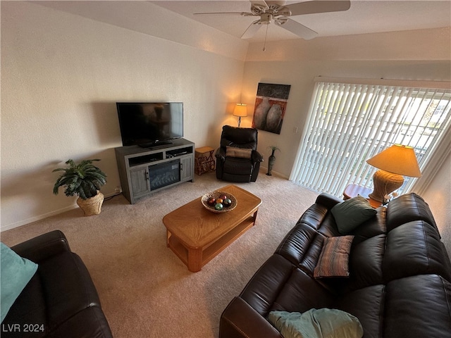 carpeted living room with ceiling fan