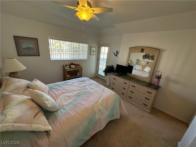 carpeted bedroom with ceiling fan and multiple windows