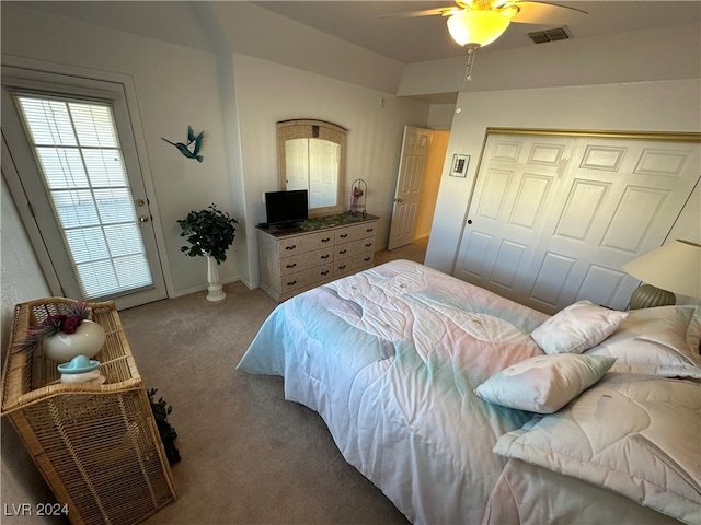 bedroom with carpet, ceiling fan, and a closet